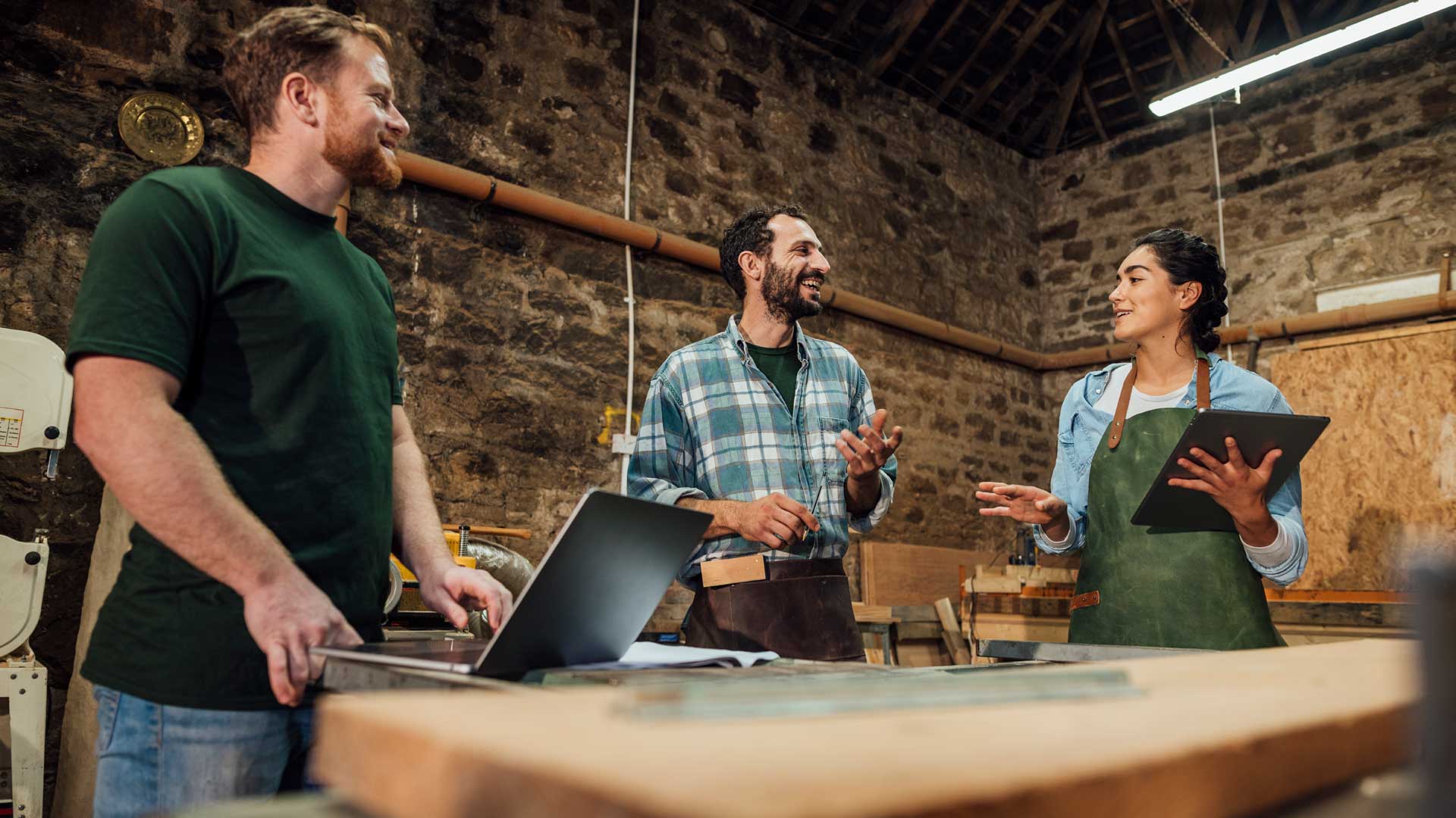 Team of three co-workers in meeting