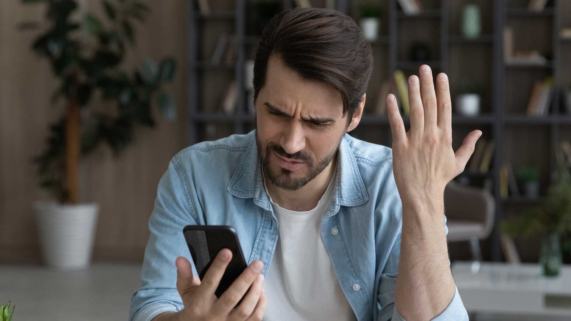 Man who has just received a phishing scam message