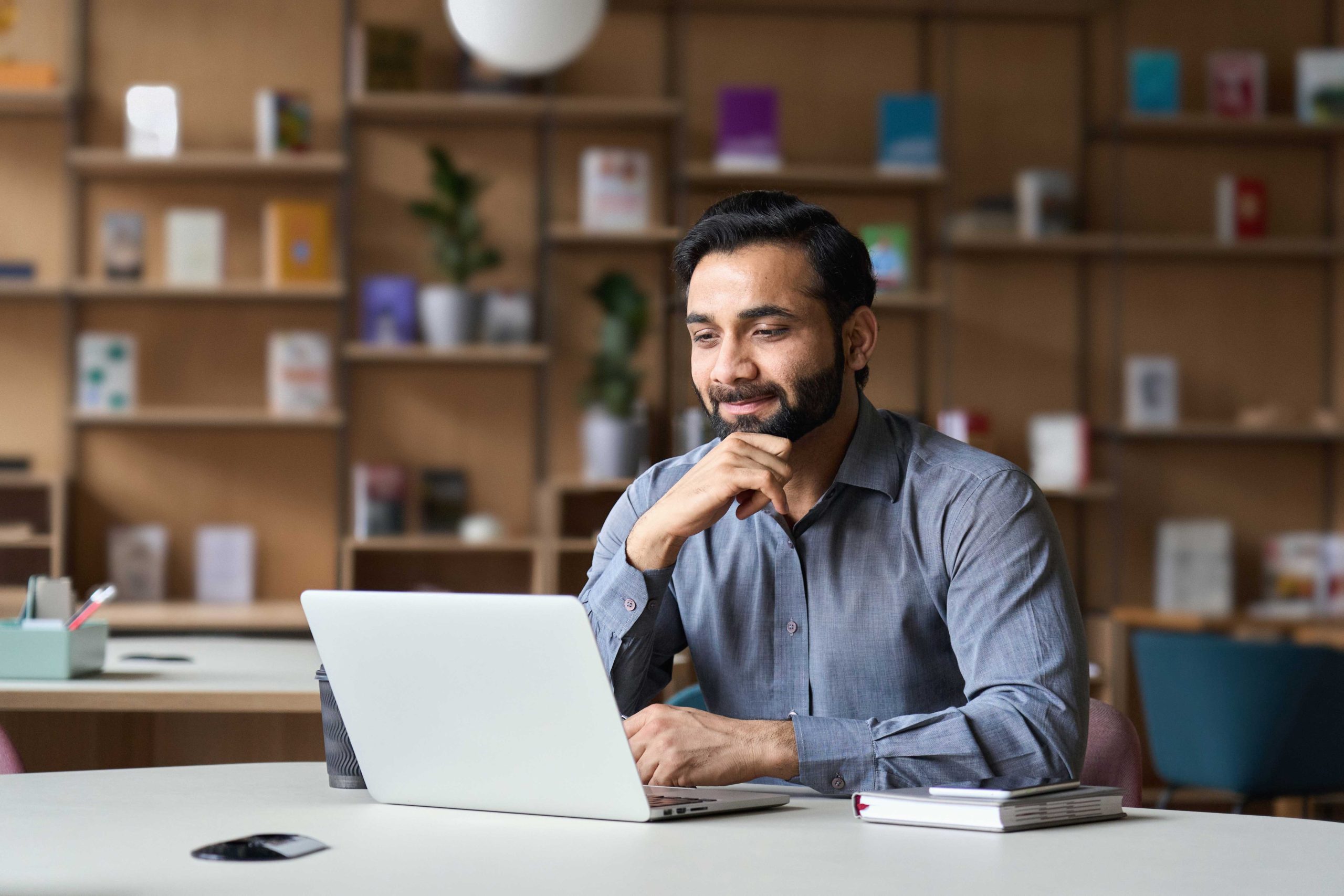 Man using a faster computer that has a solid state drive instead of a hard disk drive.